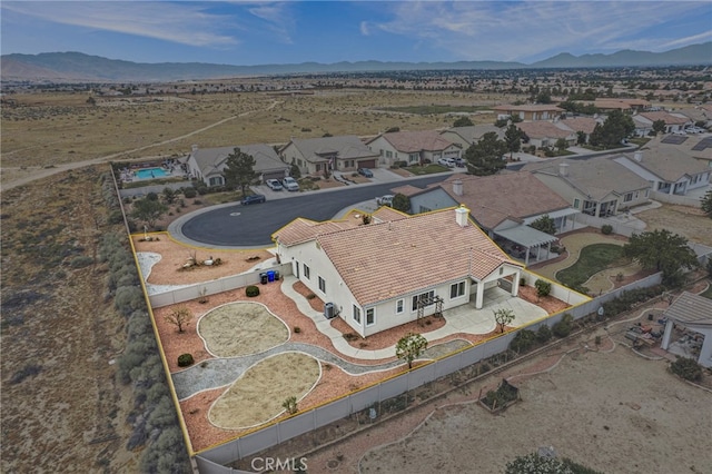 birds eye view of property featuring a mountain view