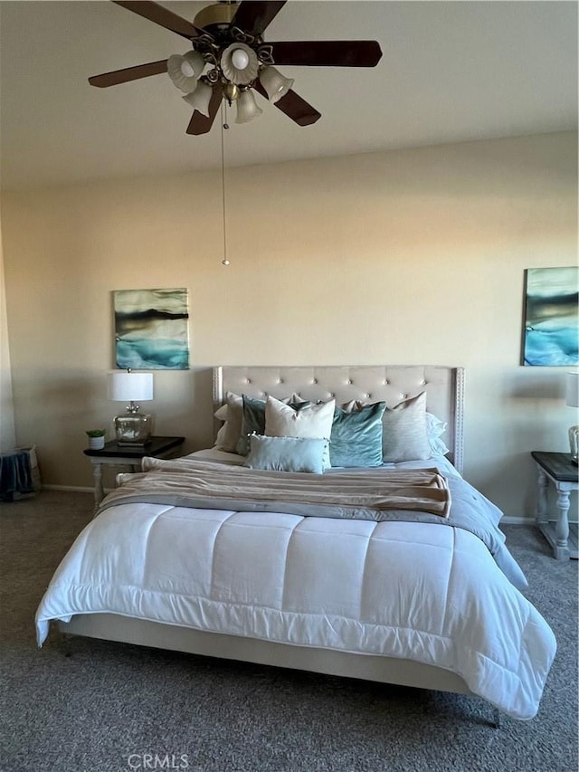 unfurnished bedroom with ceiling fan and carpet flooring