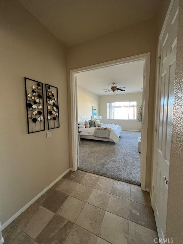 hallway featuring carpet floors