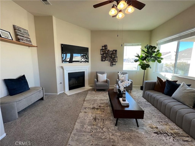 living room with carpet floors and ceiling fan