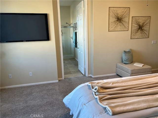 bedroom with light colored carpet and ensuite bathroom