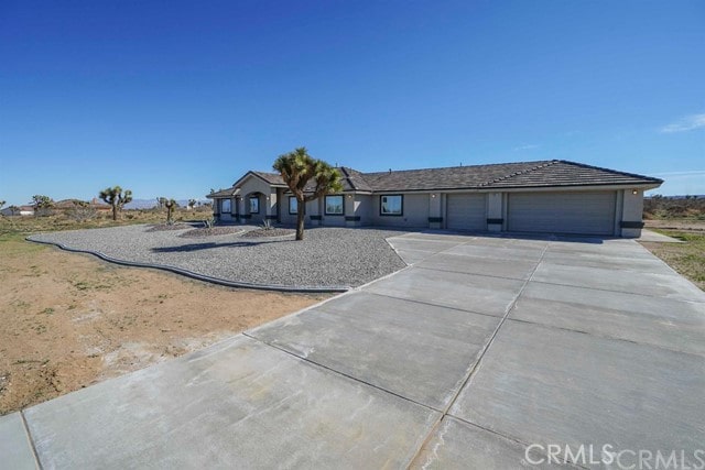 ranch-style home with a garage