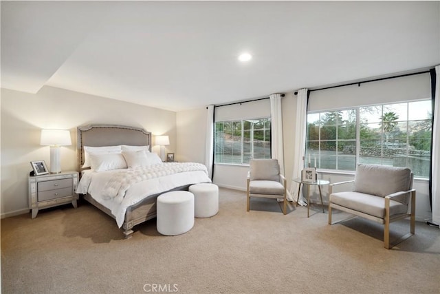 bedroom featuring light colored carpet