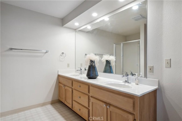 bathroom with vanity and walk in shower