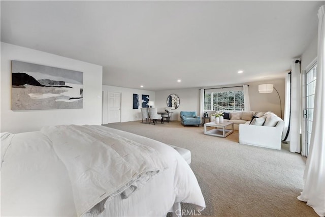 carpeted bedroom featuring multiple windows