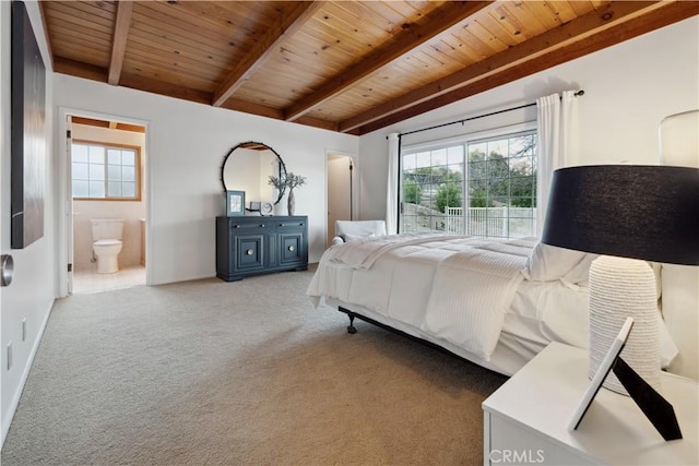 carpeted bedroom featuring beamed ceiling, connected bathroom, and wooden ceiling