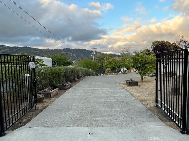 view of gate with a mountain view