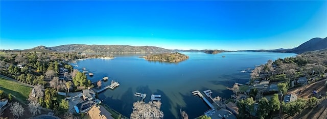 aerial view featuring a water and mountain view