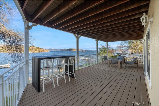 wooden terrace with a water view