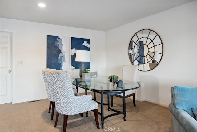 dining space featuring carpet floors