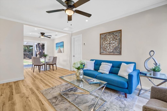 living room with crown molding and hardwood / wood-style floors