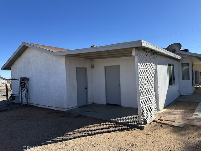 back of house with central air condition unit