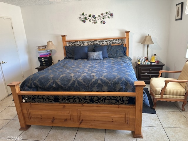 bedroom featuring light tile patterned floors