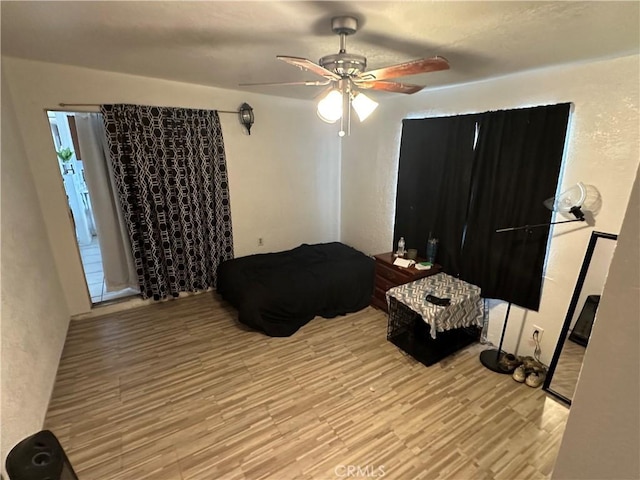 bedroom featuring ceiling fan and light hardwood / wood-style flooring