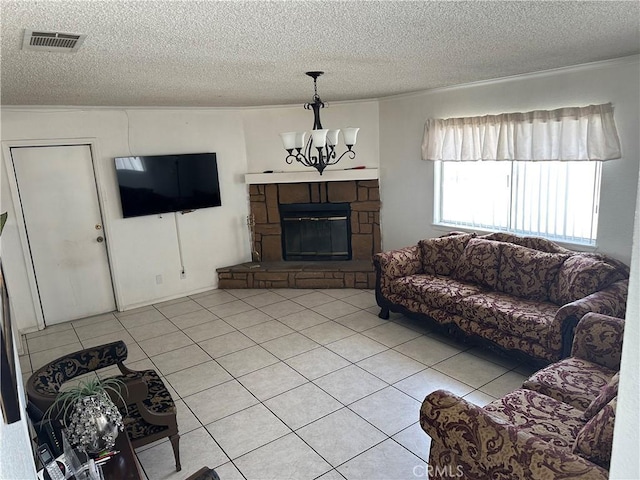 living room featuring an inviting chandelier, a fireplace, a textured ceiling, and light tile patterned flooring