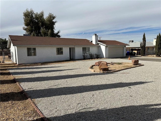 single story home with a garage