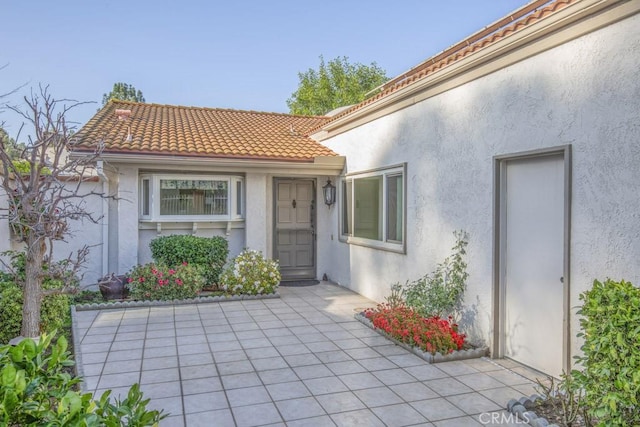 entrance to property with a patio area