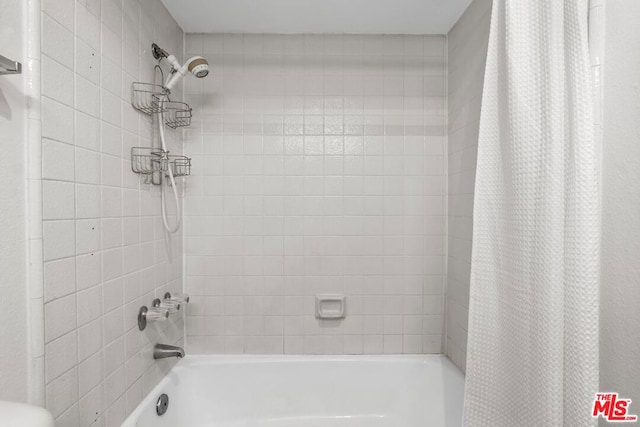 bathroom featuring shower / bath combination with curtain