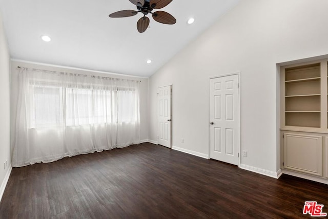 unfurnished bedroom with dark wood-type flooring, ceiling fan, and high vaulted ceiling