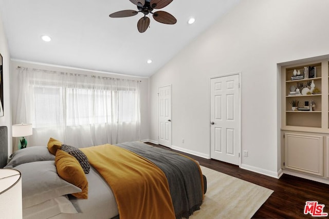 bedroom featuring ceiling fan, dark wood-type flooring, and high vaulted ceiling