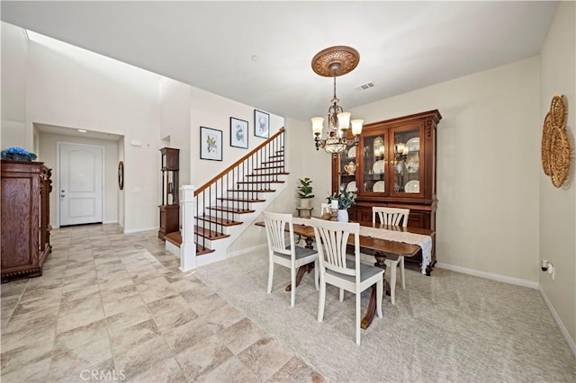 dining room featuring a notable chandelier