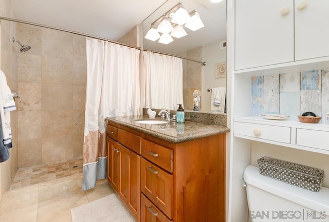 bathroom featuring vanity, backsplash, curtained shower, and toilet