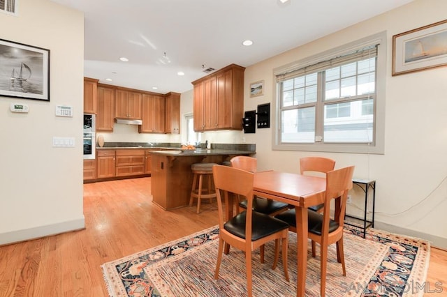 dining room with light hardwood / wood-style flooring