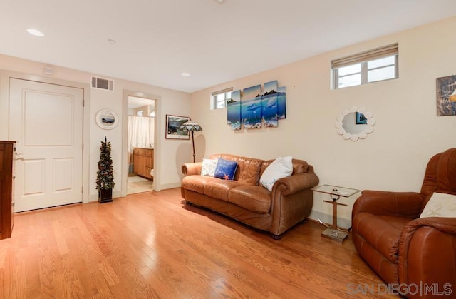 living room with light hardwood / wood-style floors