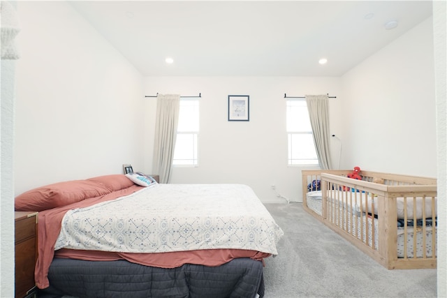 bedroom with light colored carpet