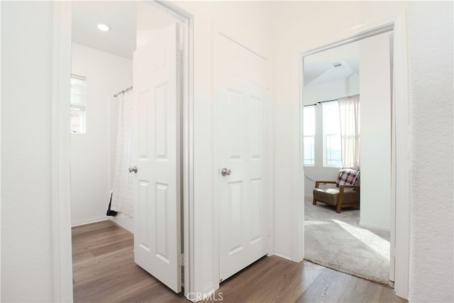 corridor featuring light hardwood / wood-style floors