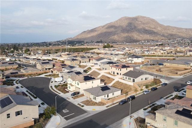 birds eye view of property with a mountain view