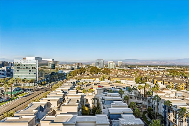 aerial view with a mountain view and a city view