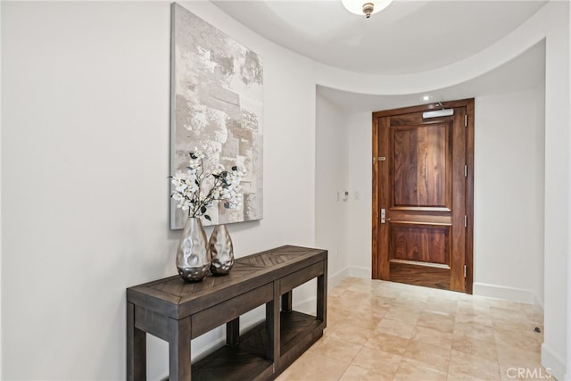 entryway featuring baseboards