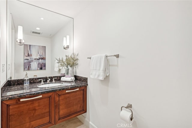 bathroom with vanity, visible vents, and recessed lighting