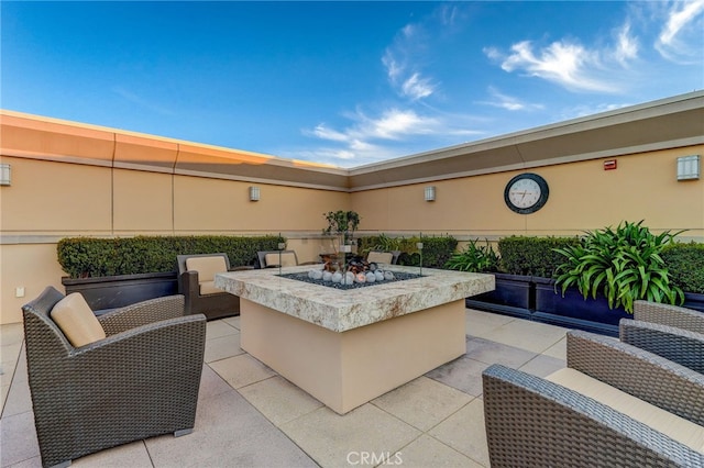 view of patio with a fire pit