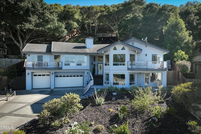 view of front of house with a balcony and a garage