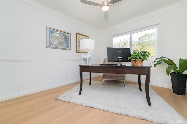 office area with ornamental molding, wood-type flooring, and ceiling fan