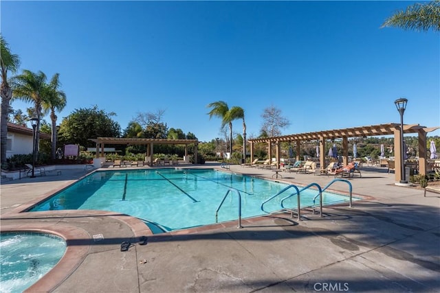 view of swimming pool featuring a pergola and a patio