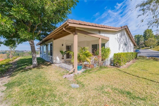 view of property exterior featuring a yard