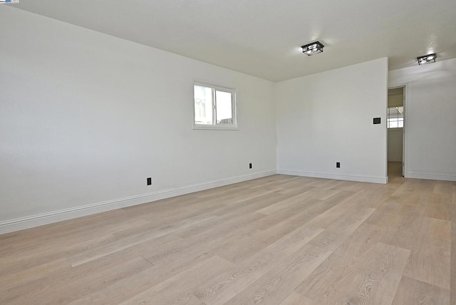 unfurnished room with light hardwood / wood-style flooring