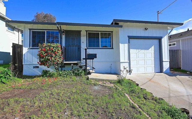 single story home featuring a garage