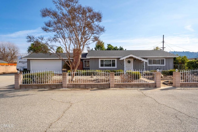 single story home featuring a garage