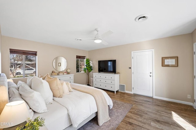 bedroom featuring hardwood / wood-style floors and ceiling fan