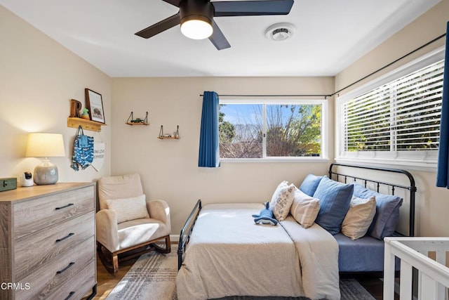 bedroom featuring hardwood / wood-style flooring and ceiling fan