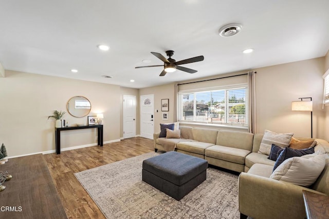 living room with ceiling fan and hardwood / wood-style floors