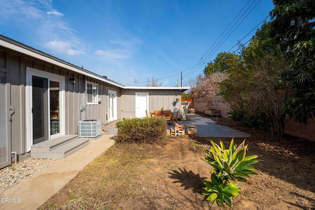 view of yard with cooling unit and a patio area