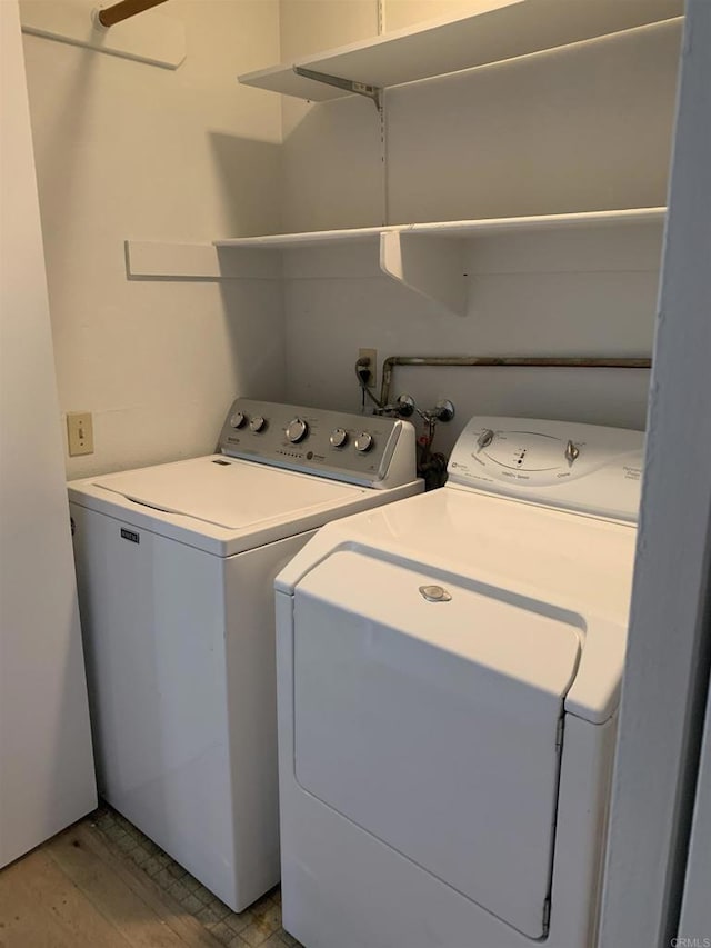 clothes washing area featuring washing machine and dryer