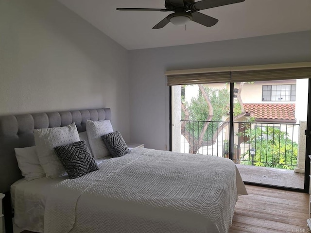 bedroom featuring vaulted ceiling, ceiling fan, light wood-type flooring, and access to outside