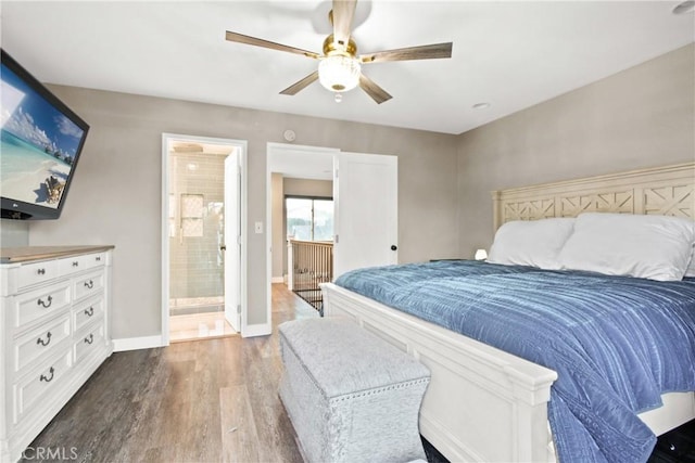 bedroom with ceiling fan, dark hardwood / wood-style flooring, and ensuite bath