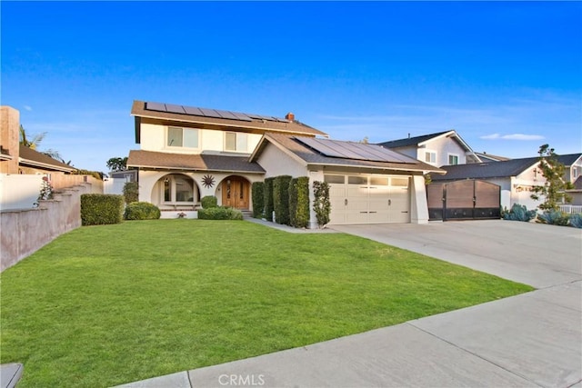 view of front of property featuring a garage, a front yard, and solar panels